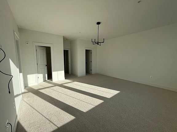 Master bedroom with his and her closets