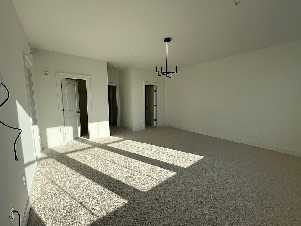 Master bedroom with his and her closets