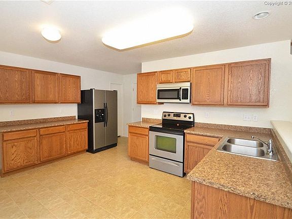Roomy kitchen with easy access to the back yard.
