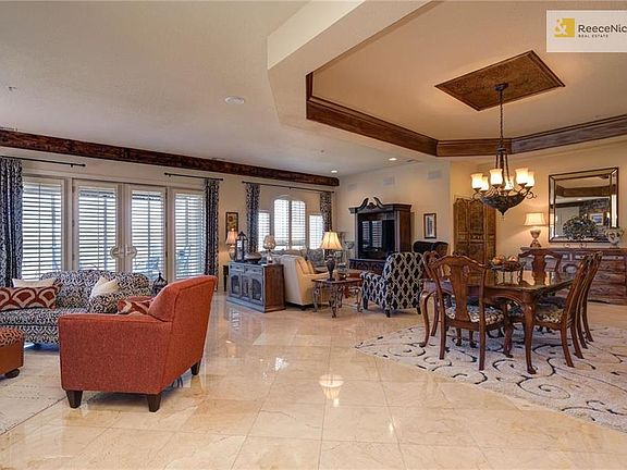 THIS is an "open concept" LivRm (cntr)..Hearth Rm(L)..Dining(R)