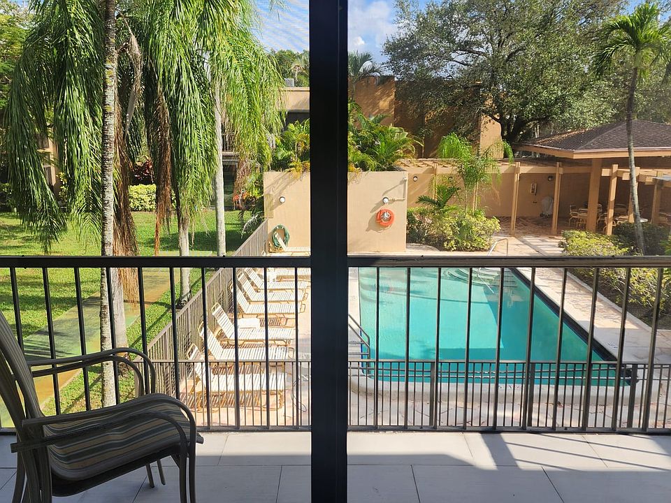 Private balcony with serene pool & golf course views_your daily unwind spot.