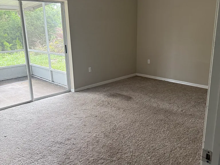 Third bedroom with access to screened patio.