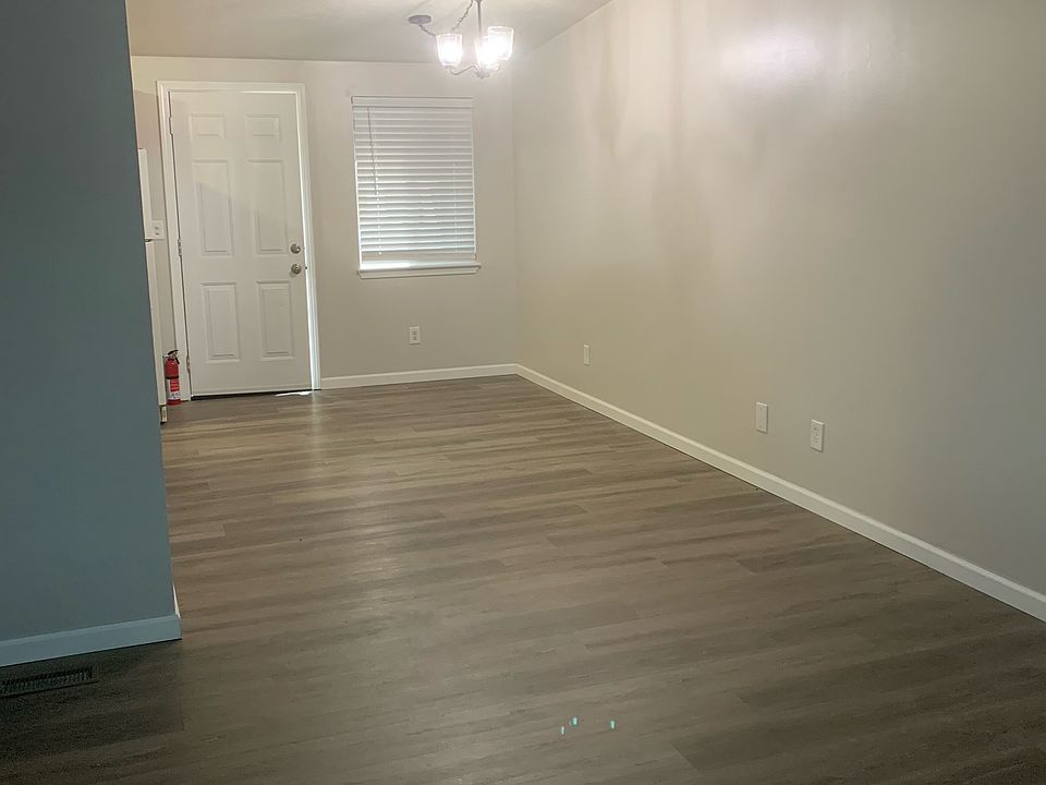 Looking into the dining room from livingroom showing back door. Kitchen is to the left.