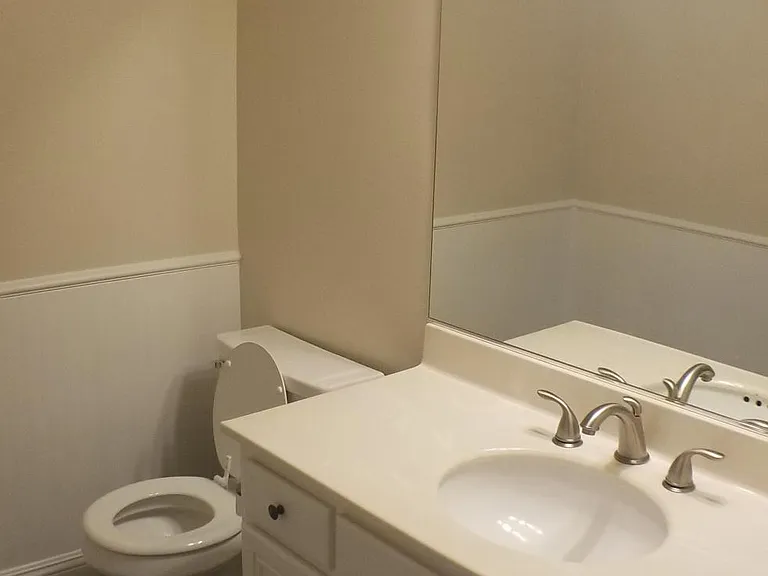 1st floor powder bath

*NOTE: This photo is not current, the bathroom has been completely updated with new vanity, quartz countertop, new sink, new faucet, new mirror, new exhaust fan, and new toilet