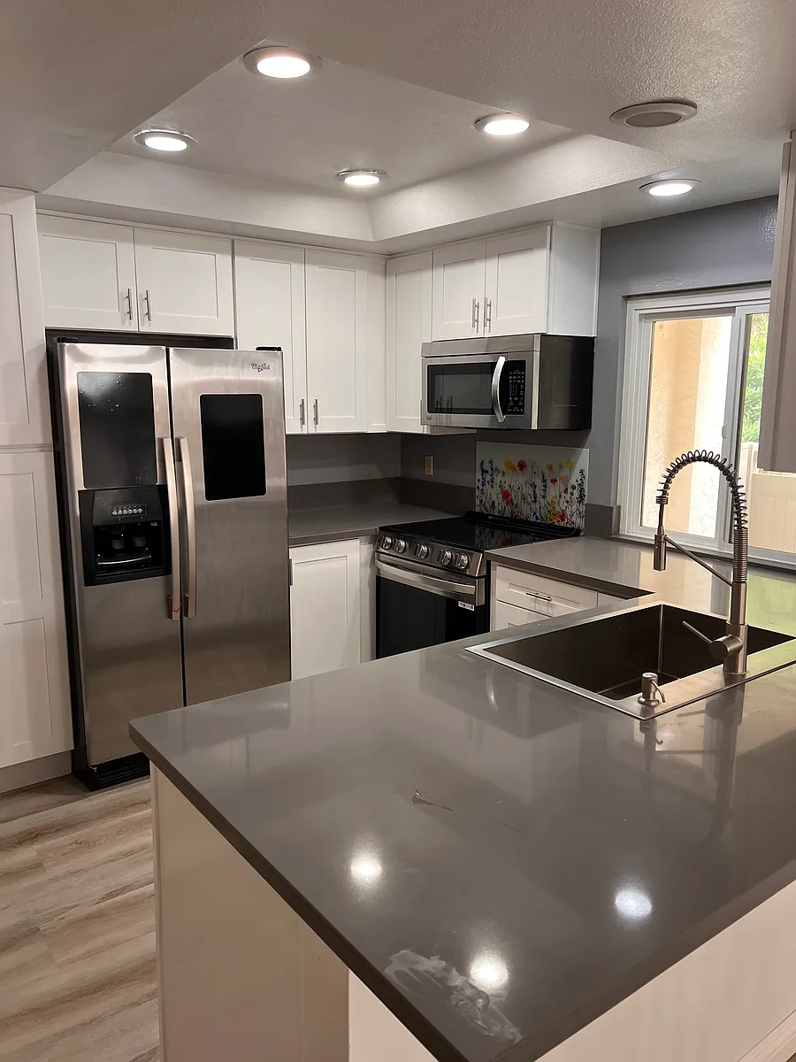 Cabinet storage with modern white finishes. - 8767 Gilman Dr