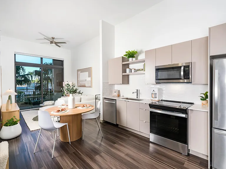 Apartment Home Interiors Gally Caption: Modern kitchens with sleek quartz, double-basin sinks, and chef's island storage.