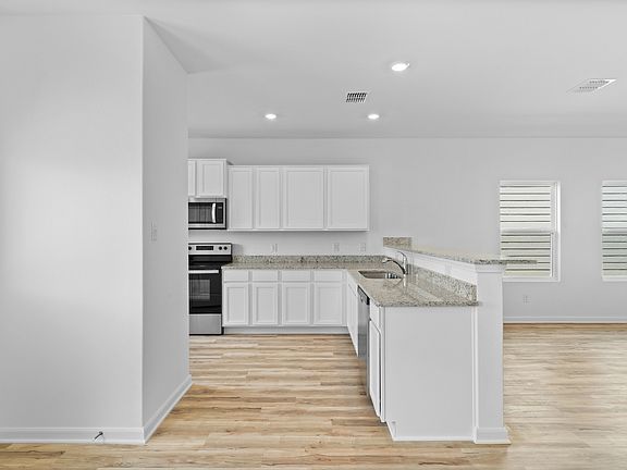 The chef-ready kitchen overlooks the family room
