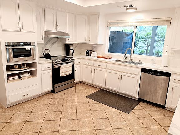 Spacious kitchen with new microwave drawer, electric stove,/ and dishwasher