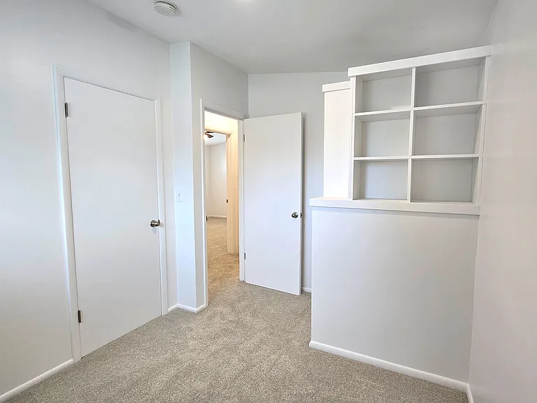 Bedroom 3 with closet and storage cubby system