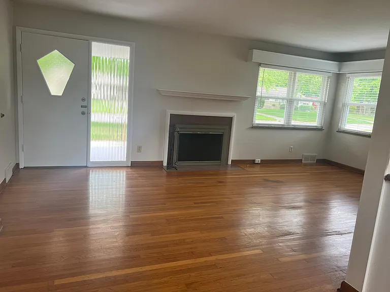 Living room with wood burning fireplace