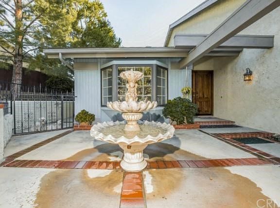 Peaceful Fountain within gated courtyard.