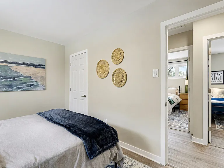 Bright secondary bedroom with stylish decor in our family-friendly Ottawa furnished rental.