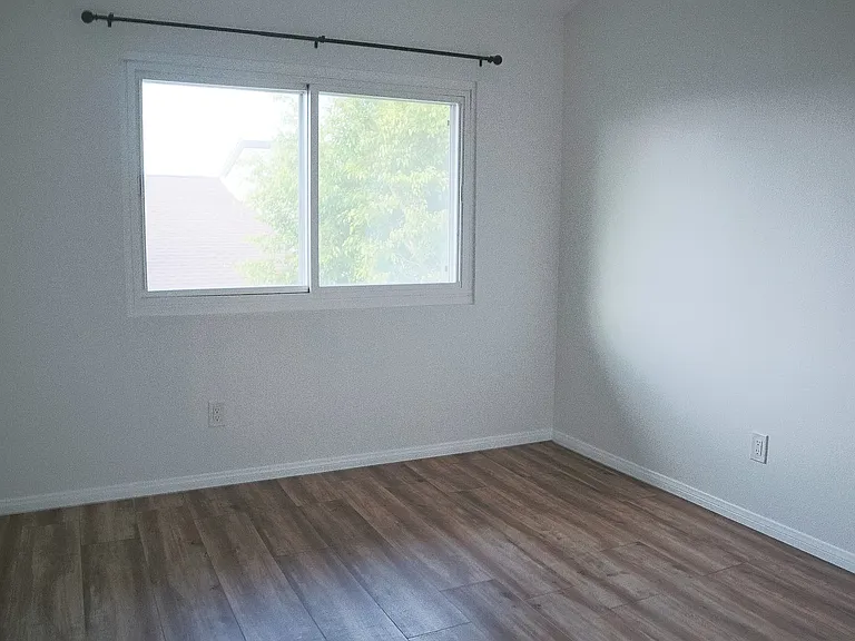 Bedroom #2 with vaulted ceilings.