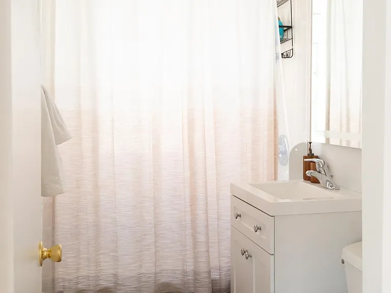 Recently renovated bathroom with extra towels