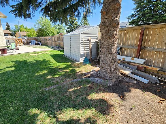 View to front from southeast corner. (Deck furniture and Maintenance shed not available)