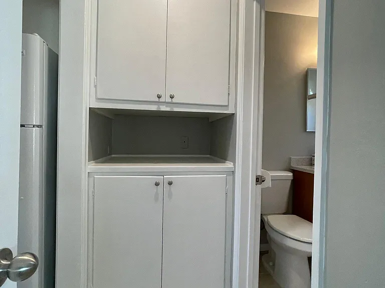 Hallway linen cabinet for extra storage.