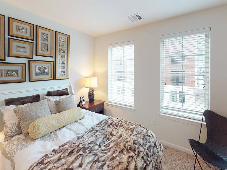 Bedroom fit for a king with plush wall-to-wall carpeting