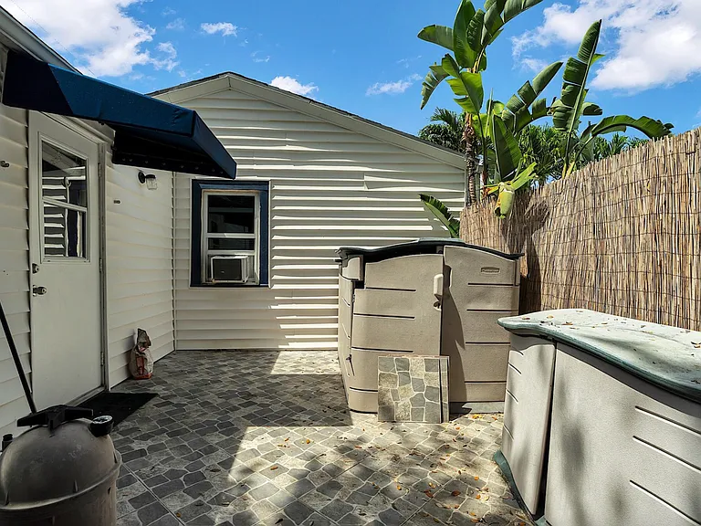 Additional private patio. Totally locked and secure. Great for keeping bikes, paddle boards, beach chairs, umbrellas