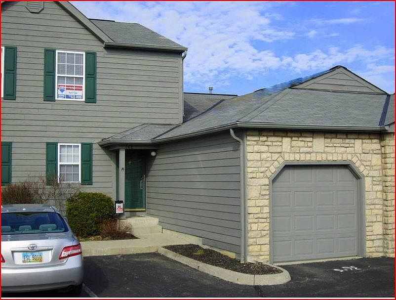 front view with attached one car garage