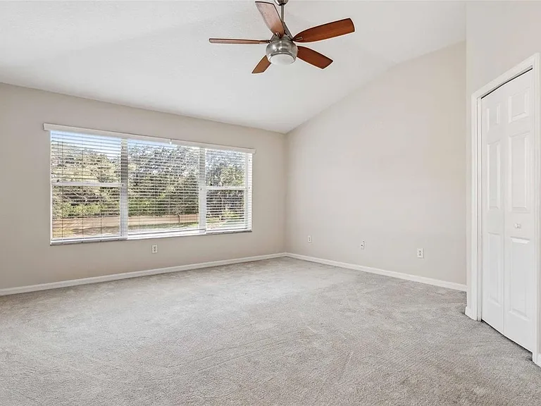 Master bedroom upstairs with walk in closet and bathroom and pond view