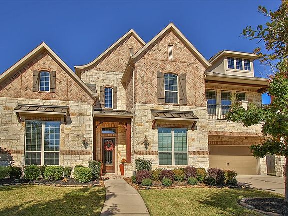 The home has easy to care for landscaping in the front yard while the brick and stone accents on the home add to the charm and character of the home.