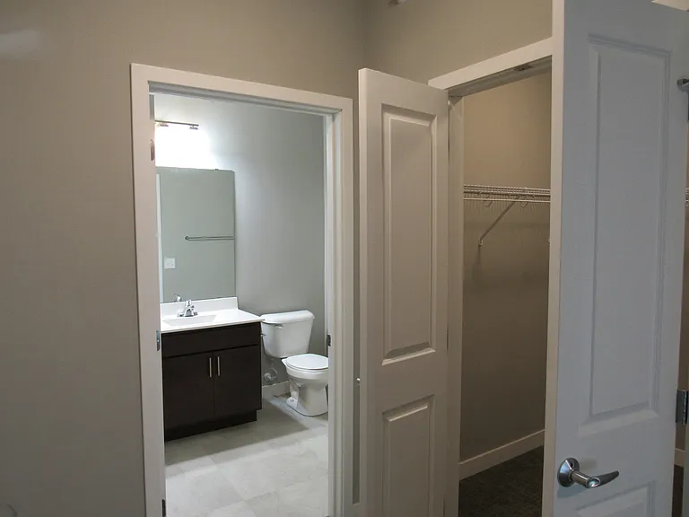 A walk-in closet next to the master bath.