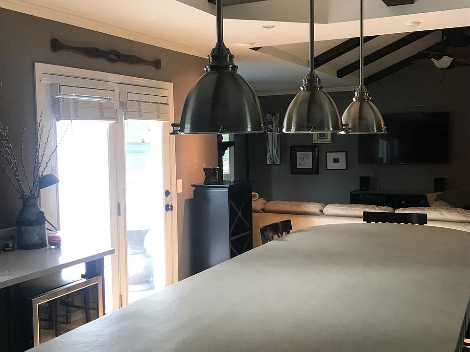 Large kitchen island, open floor plan with vaulted living ro