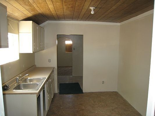Kitchen looking into indoor laundry
