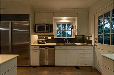 Kitchen with stainless steel appliances and Corian counter tops