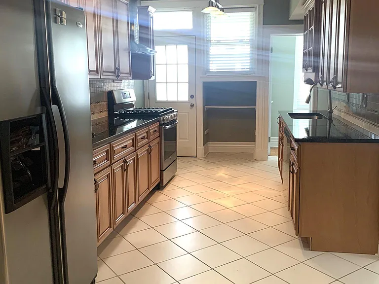 Spacious kitchen with ceramic flooring