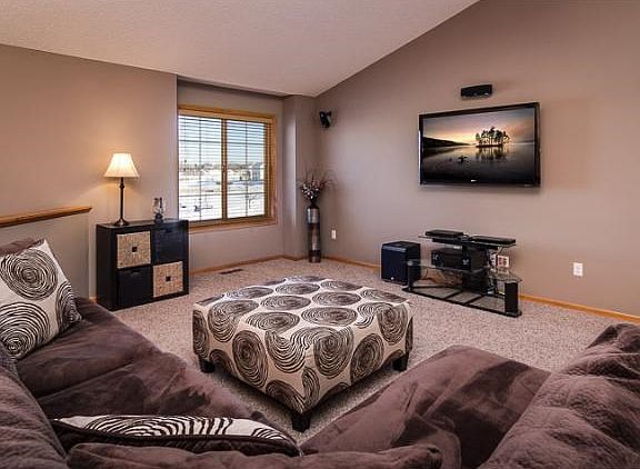 Large open family room with no separation to the kitchen and dining room. A great space to entertain family and friends. The front window overlooks the community park.