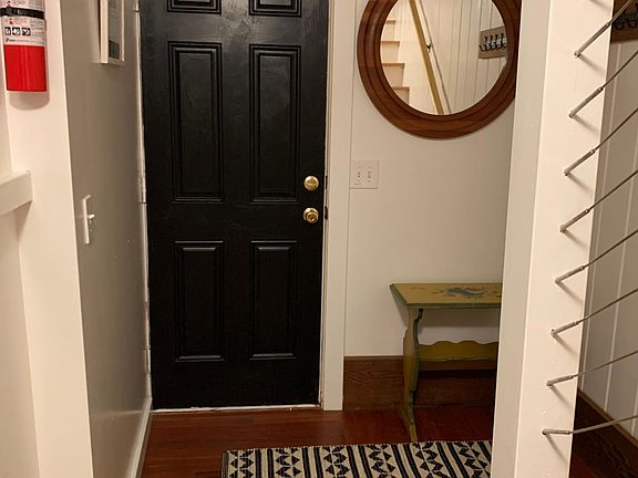 Downstairs foyer with built in coat rack