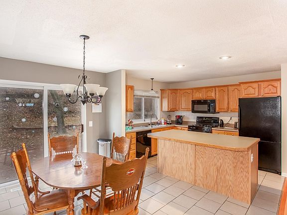 Kitchen has breakfast bar and dining area which walks out to a nice deck and fenced yard!