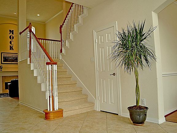 Formal Staircase with Front and Back Stairs.