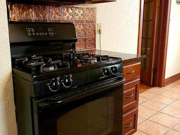 Gas stove with built-in microwave