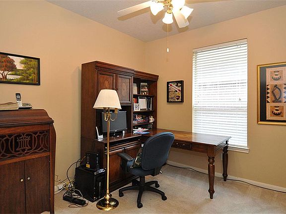 The study is a comfortable room with French doors.