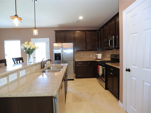 The long view of the kitchen and pantry area.