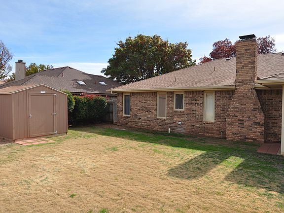 Backyard with 8x10 storage shed