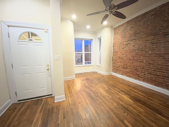 Front entrance and living room with large front window alcove