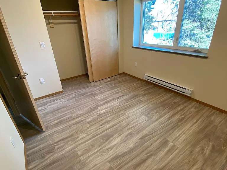 Rear bedroom, closet has sliding doors