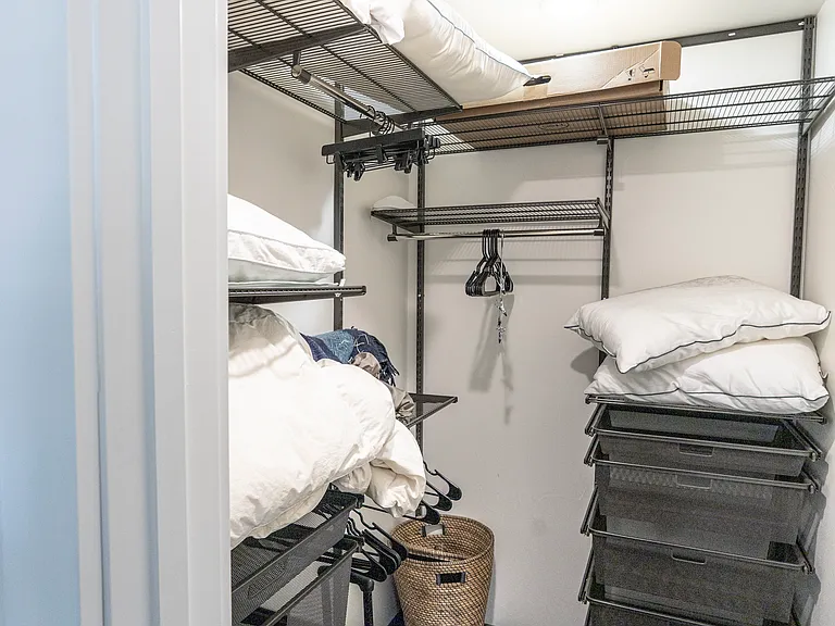 Huge walk-in closet with custom drawers and shelves