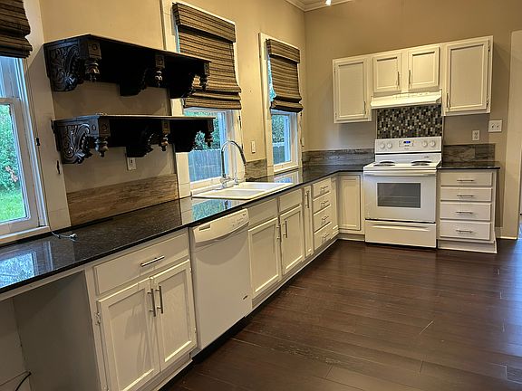 Kitchen with stove and dishwasher you supply the refrigerator
