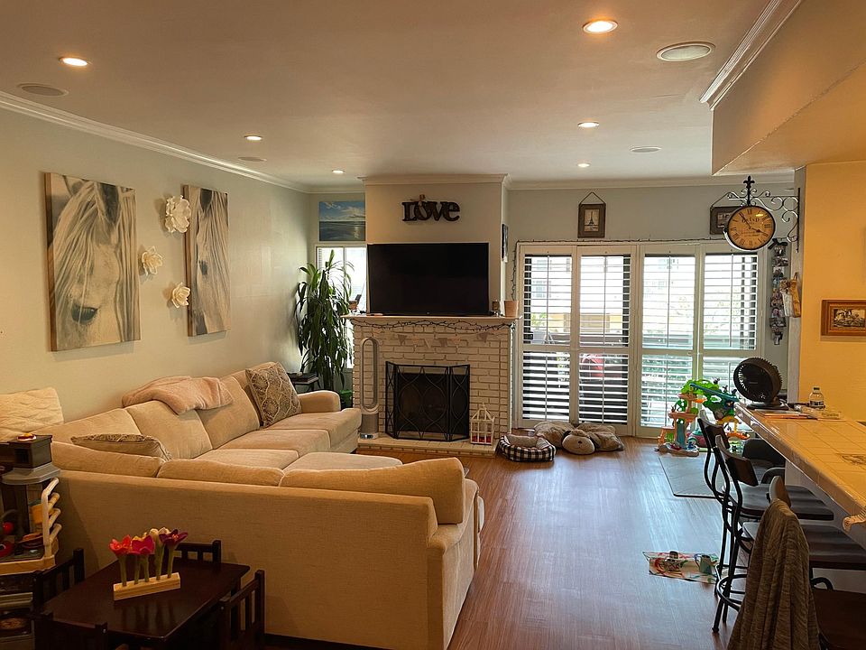 Living Room with Fireplace, and Balcony