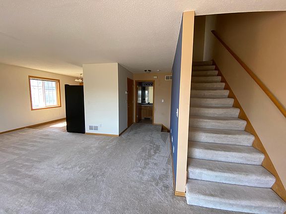 Living area + stairs to upper level