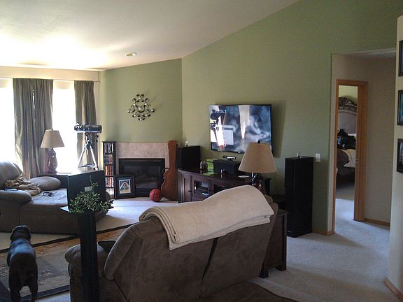 Extremely large great room with fire place and vaulted ceiling. 