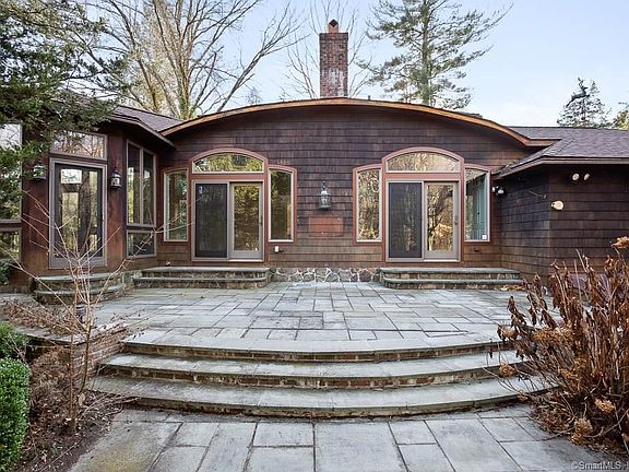 Gorgoues patio with two sets french doors entering into the dining room and kitchen