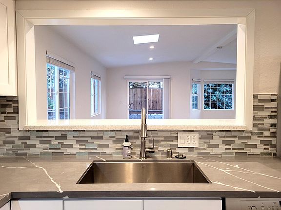 Kitchen pass-through window with bar