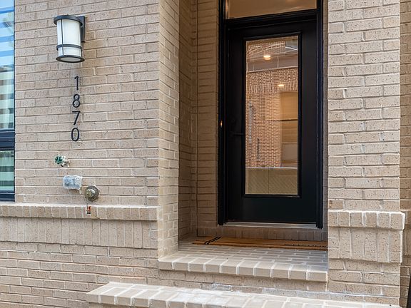 The stunning sand exterior is a perfect entryway to exceptional living.