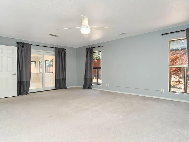 Large windowed doors connect to the flex space.