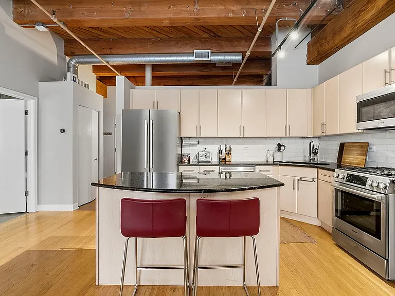 Fully equipped kitchen with island, gas stove, oven, microwave, dishwasher and garbage disposal!